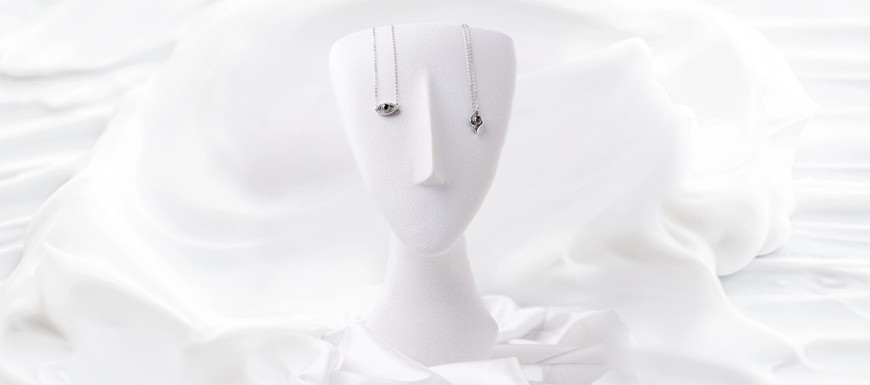 QRystal SoulGate eye and MemoryShell leaf silver pendants with integrated QR technology